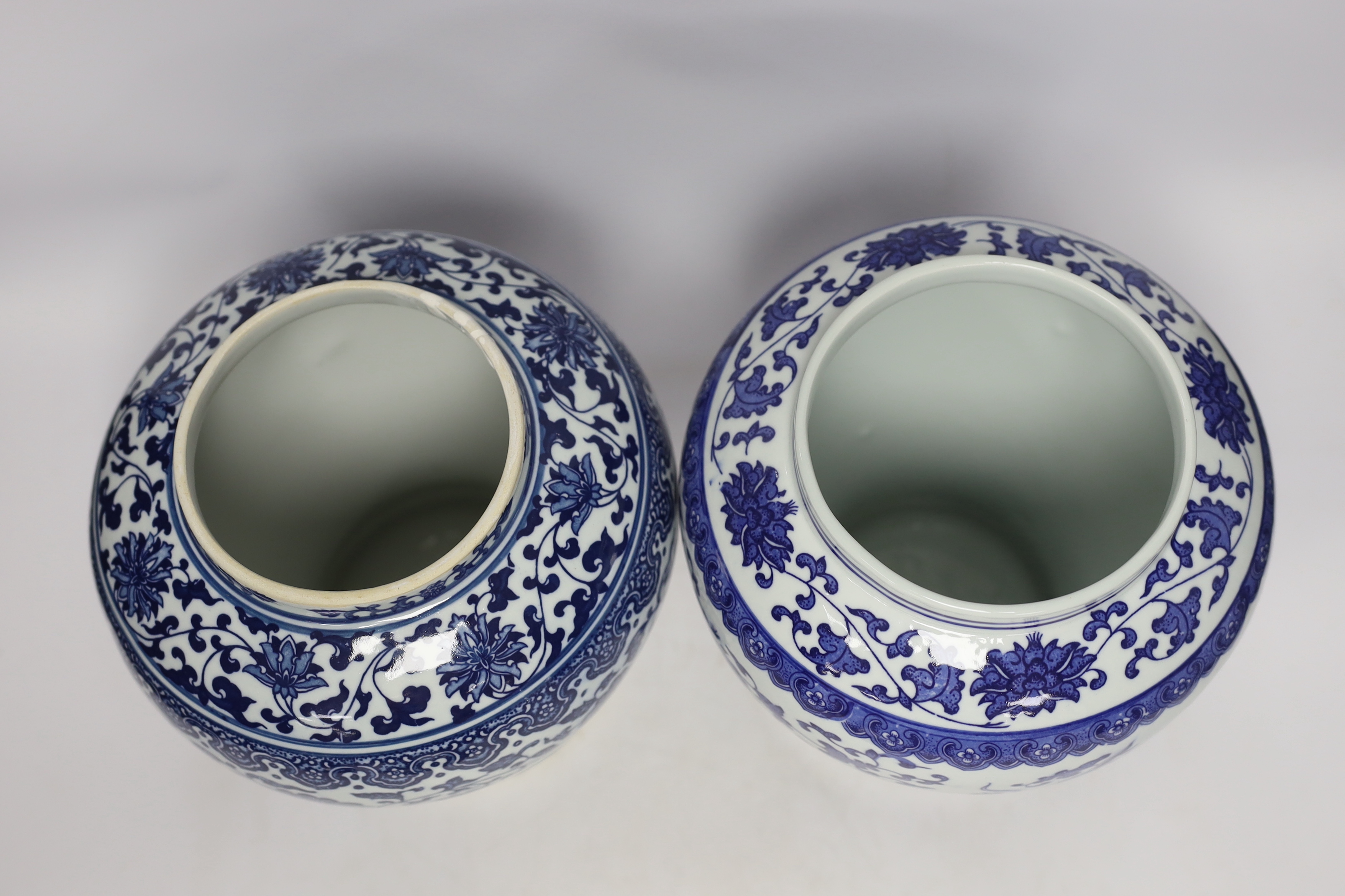 Two Chinese blue and white vases and covers, 38cm high